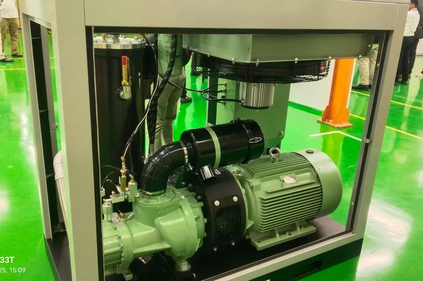 Screw compressor with green base painted floor